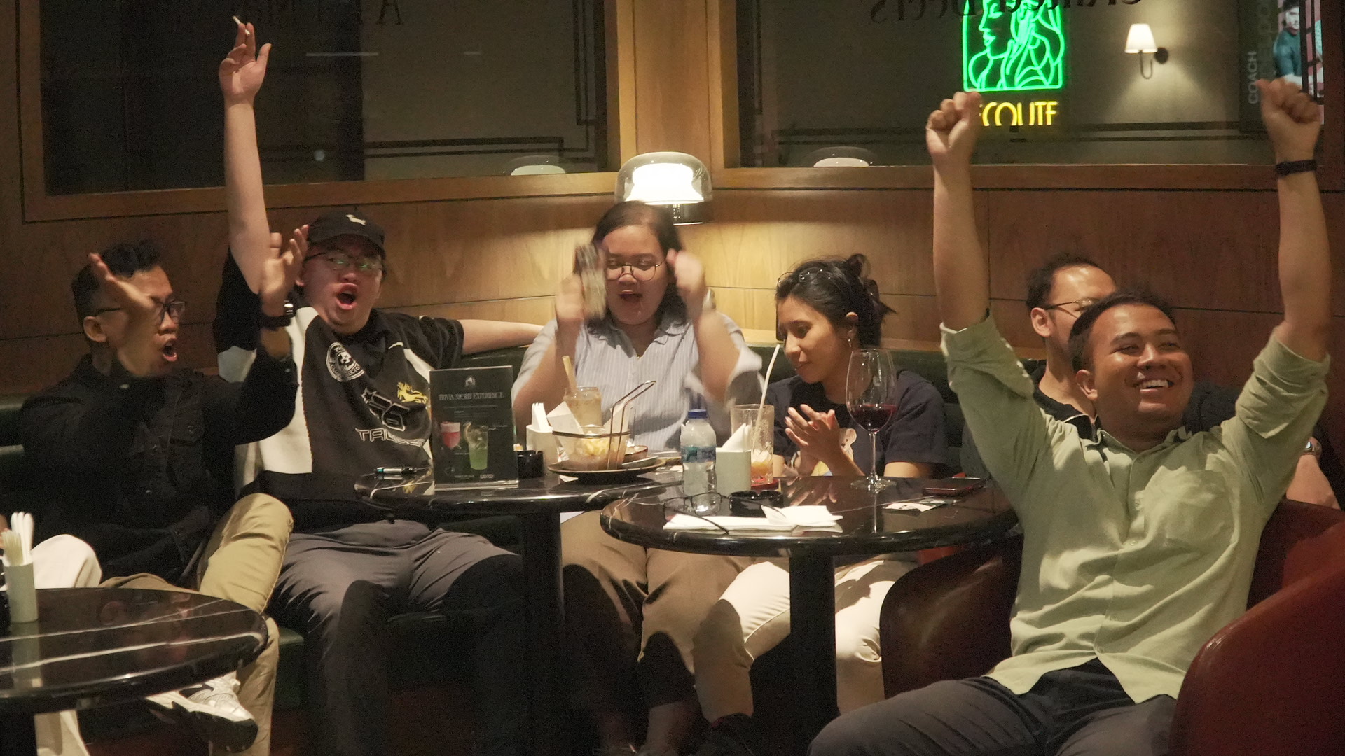 Guests cheering during ARC Trivia Night at Le Baron Lounge